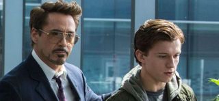 Tony Stark (Robert Downey Jr.) puts a hand on Peter Parker's (Tom Holland) back in Spider-Man: Homec