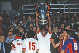 Marcel Desailly celebrates with the Champions League trophy after AC Milan's win in the final against Barcelona in May 1994.