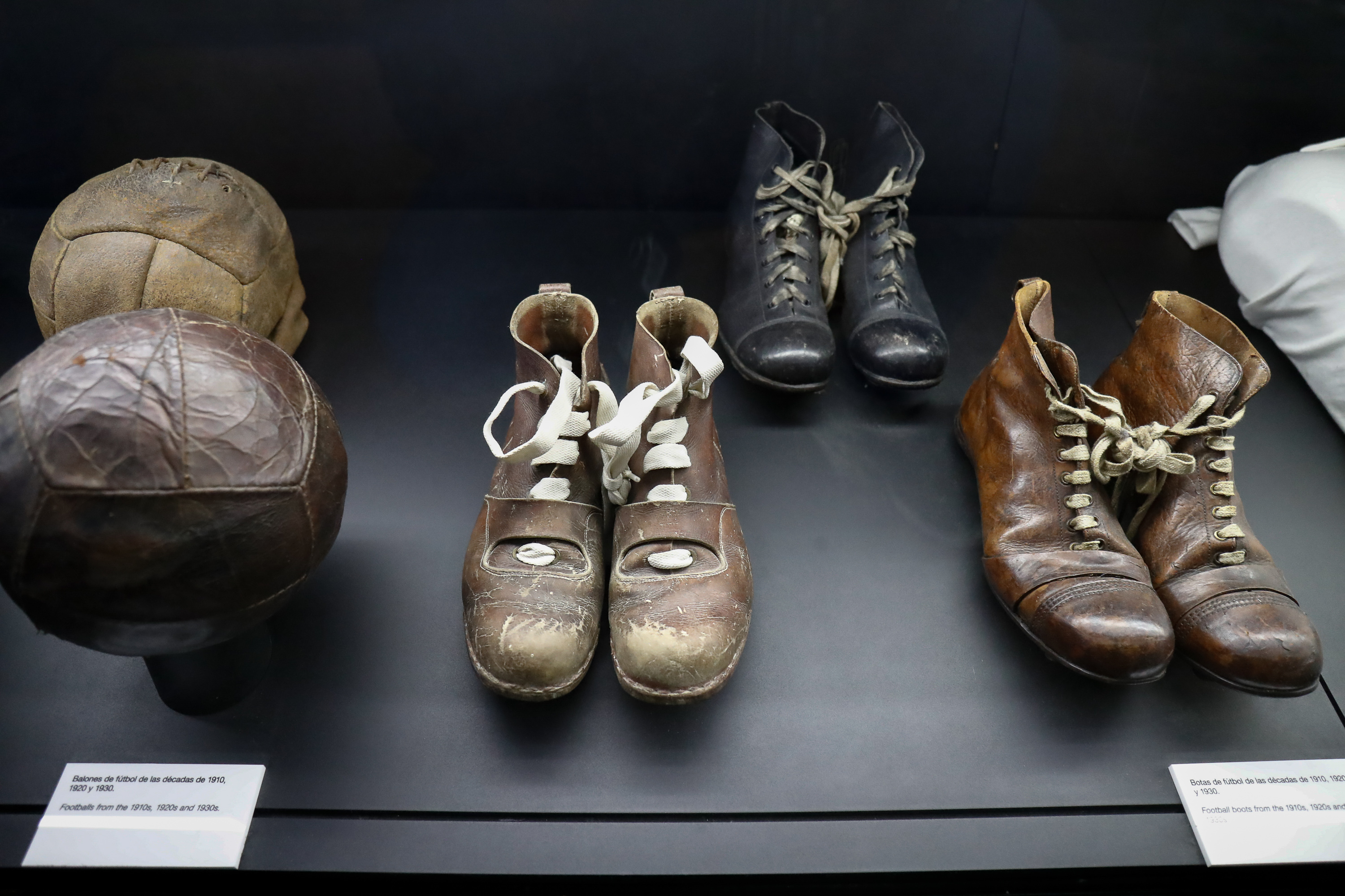 Boots and balls from the 1910s, 1920s and 1930s on show at the Real Madrid museum at the Santiago Bernabeu in March 2020.