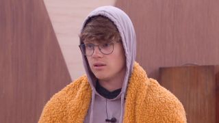 Kyle Capener wearing a blanket on Big Brother