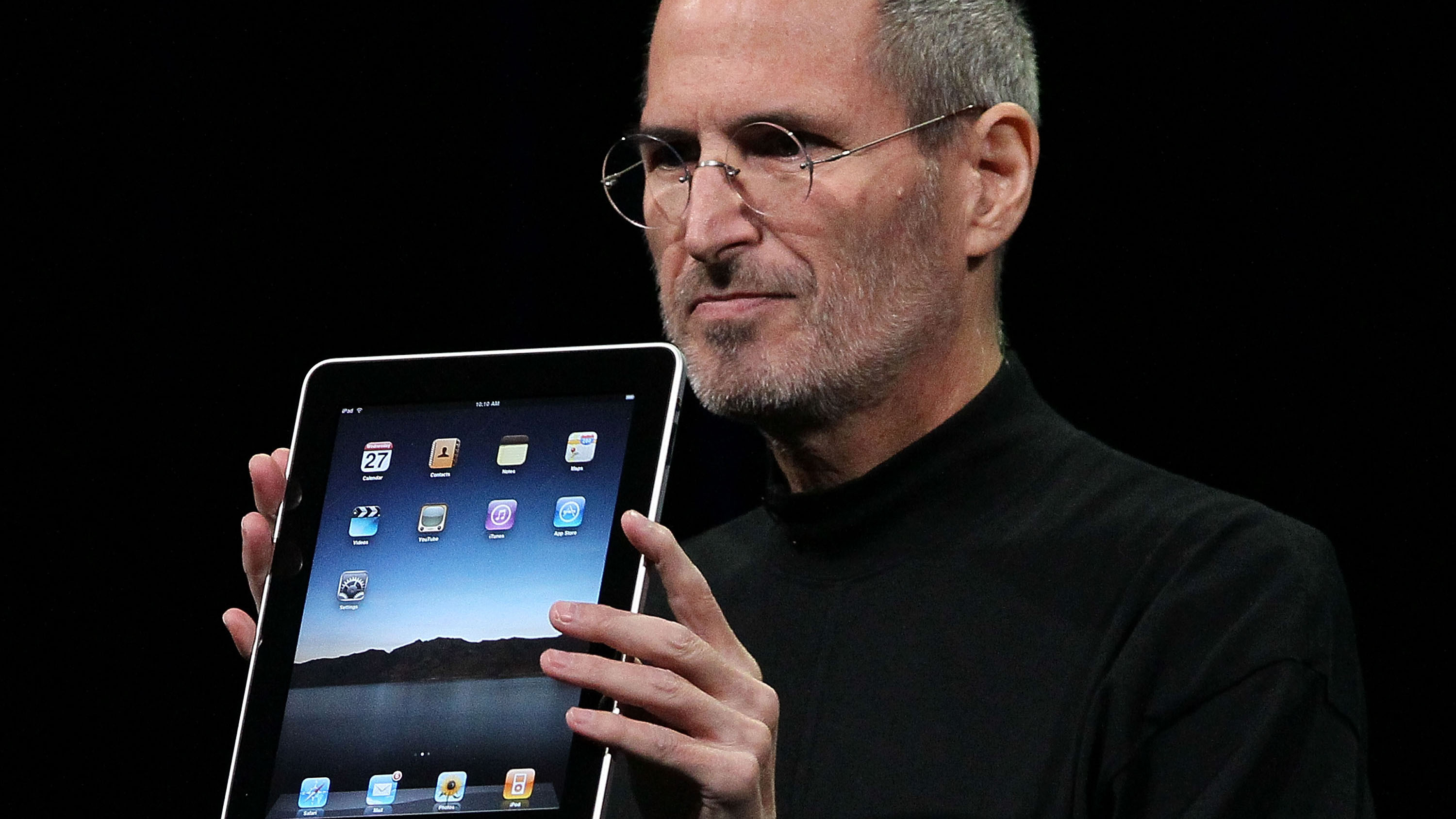 Apple Inc. CEO Steve Jobs holds up the new iPad as he speaks during an Apple Special Event at Yerba Buena Center for the Arts January 27, 2010 in San Francisco, California.