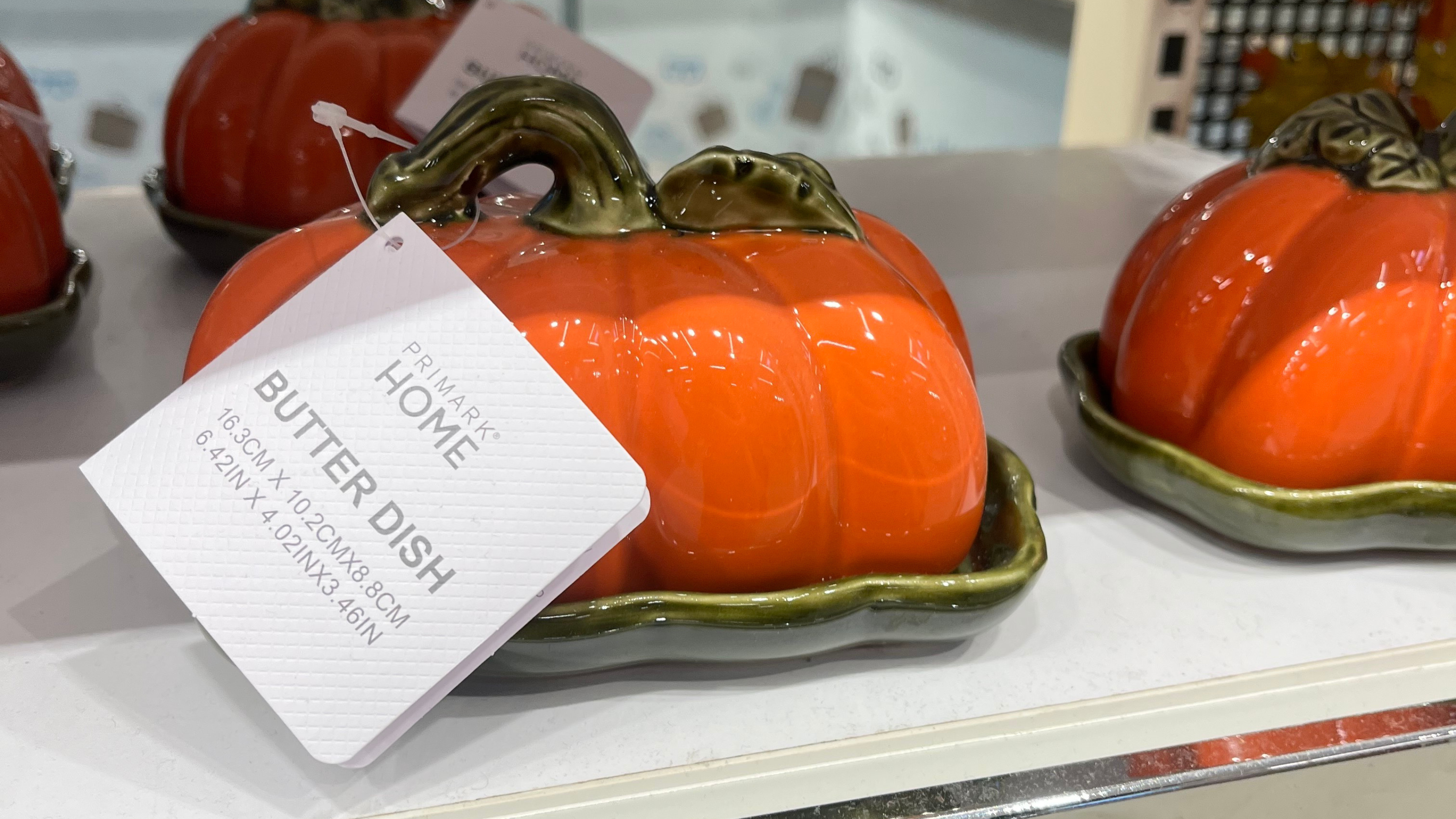 Close-up of Primark pumpkin butter dish in store.
