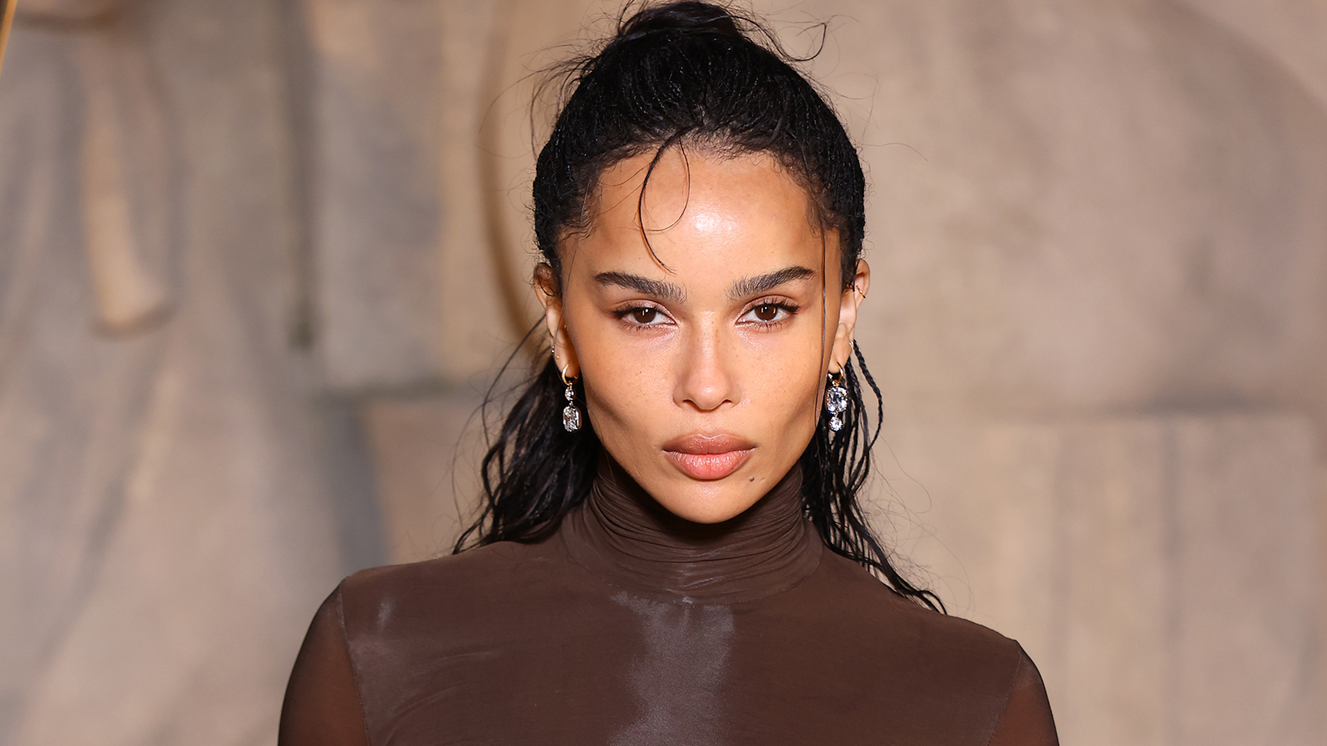 Zo&euml; Kravitz attended the Saint Laurent Fall 2026 show in a chocolate brown turtleneck look from the label