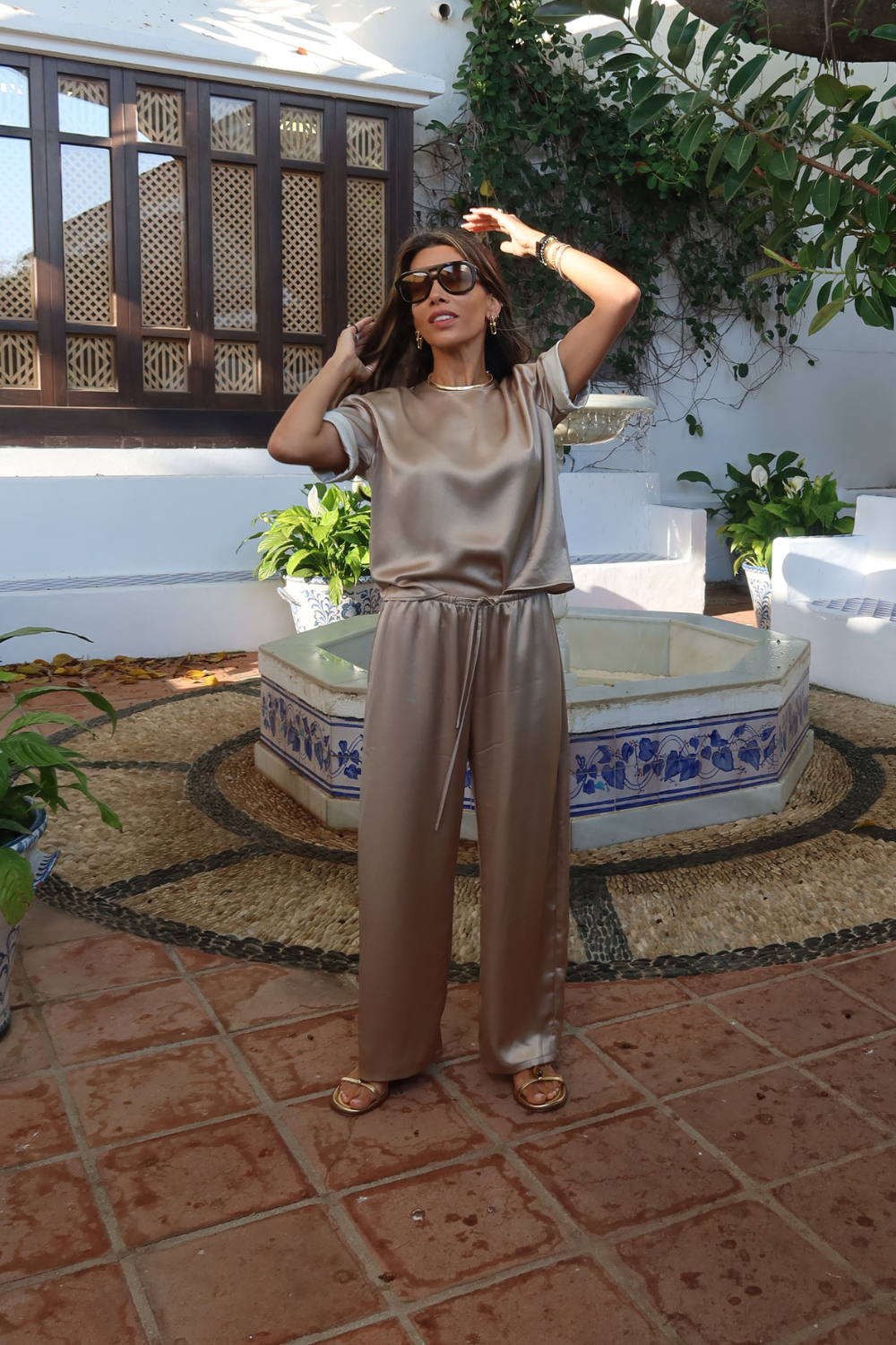 Leila Kashanipour wears beige silk trouser set