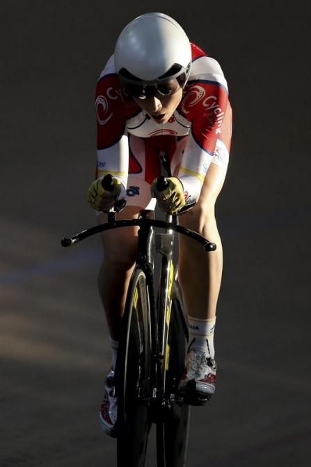 Annette Edmondson catches some afternoon light on her way to winning gold in th eindividual pursuit.
