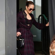 Jennifer Lopez in a red plaid dress and matching bra top