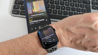 iPhone 12 and Apple Watch Series 8 showing Amazon Music