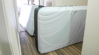 Two twin XL Tempur-Pedic Tempur-Adapt mattresses in a hallway