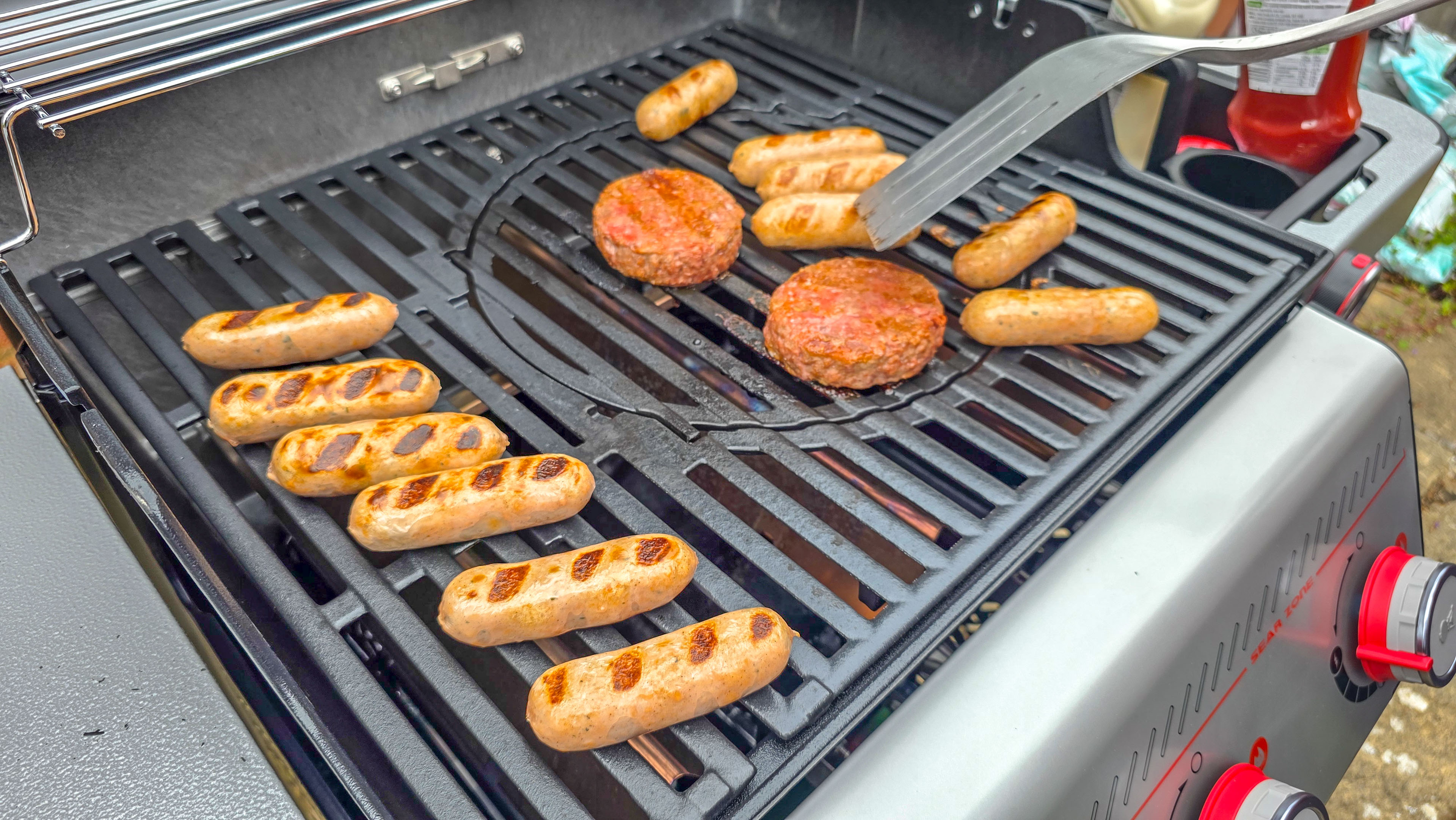 Weber Spirit EX325 grilling burgers and sausages