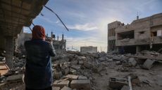 People inspect the damage to their homes following Israeli air strikes in Rafah, Gaza