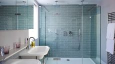 Blue brick metro tiles in a glass shower