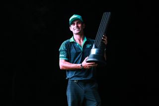 Joaquin Niemann holds a LIV Golf trophy