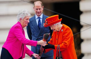 Queen Elizabeth II and Prince Edward, Earl of Wessex with Dame Louise Martin, President of the Commonwealth Games Federation, during the launch of the Queen's Baton Relay