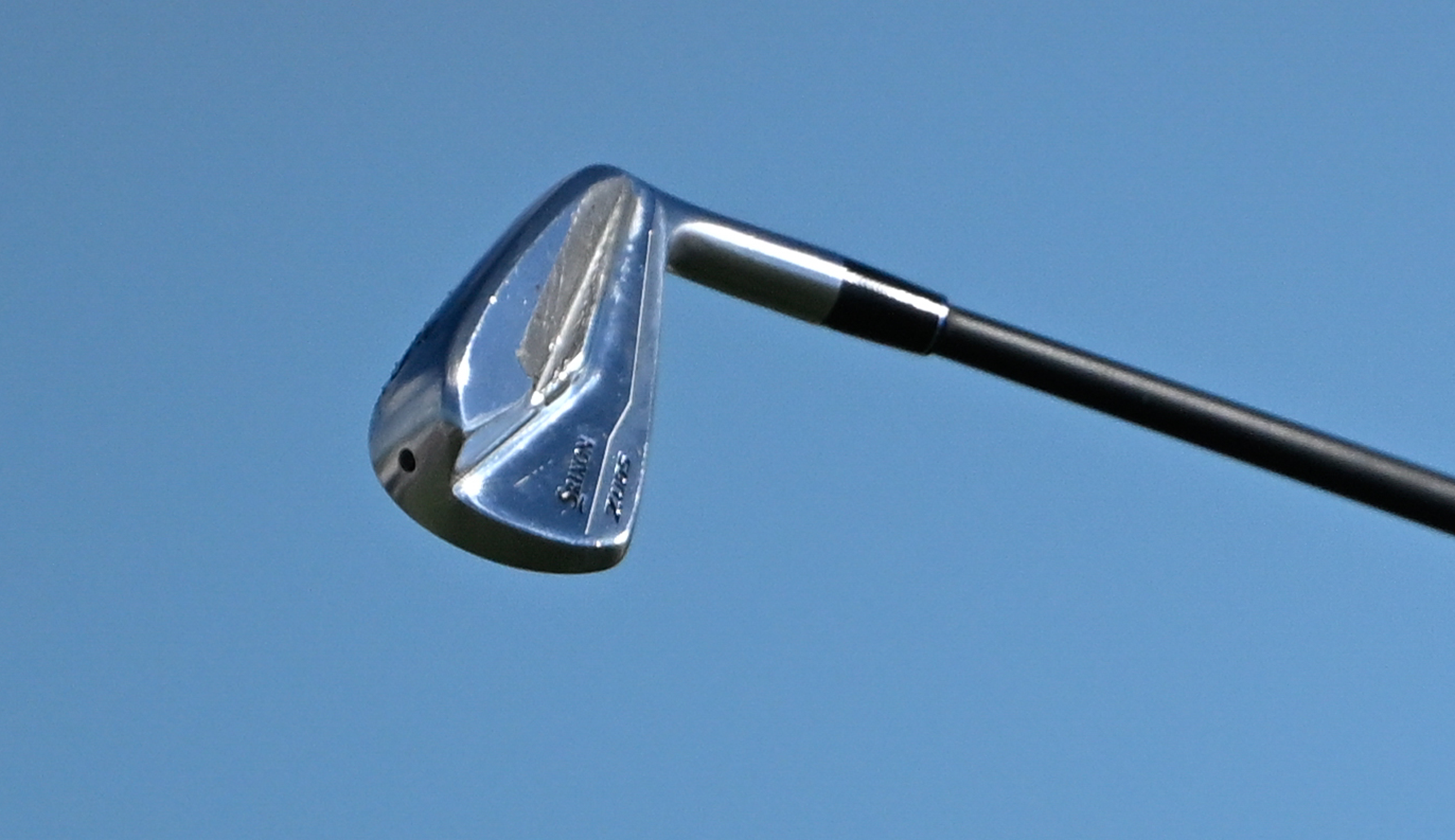 A close-up of Scottie Scheffler's Srixon iron