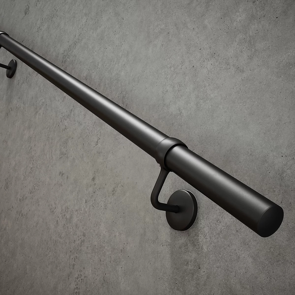 black handrail on grey wall