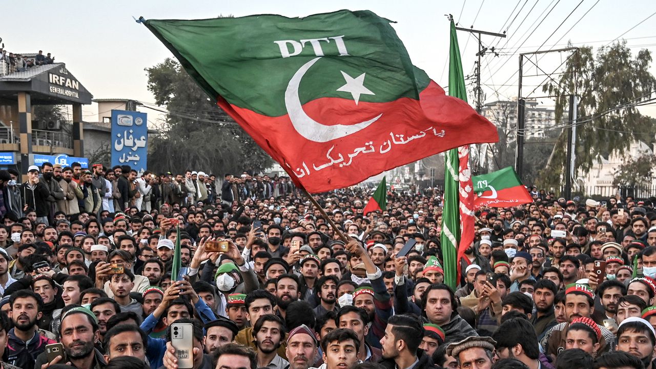 Supporters of Pakistan Tehreek-e-Insaf (PTI) party protest outside the office of a Returning Officer in Peshawar