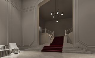 A 3D render of the lobby with a tall opening through which is a wide staircase that branches out to left and right.