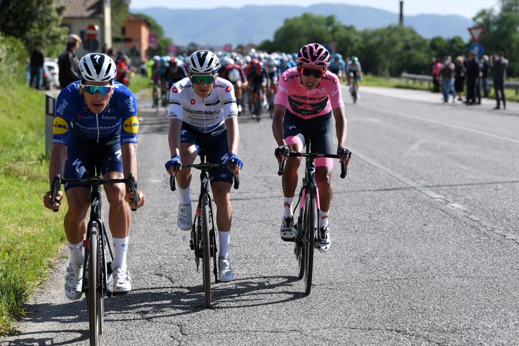 FOLIGNO ITALY MAY 17 Joao Almeida of Portugal and Team Deceuninck QuickStep Remco Evenepoel of Belgium and Team Deceuninck QuickStep white best young jersey Egan Arley Bernal Gomez of Colombia and Team INEOS Grenadiers Pink Leader Jersey during the 104th Giro dItalia 2021 Stage 10 a 139km stage from LAquila to Foligno girodiitalia Giro on May 17 2021 in Foligno Italy Photo by Tim de WaeleGetty Images