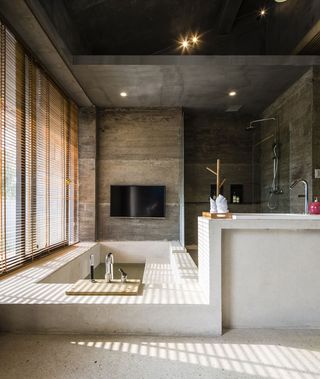 Bathroom with cavernous tubs and soft lighting