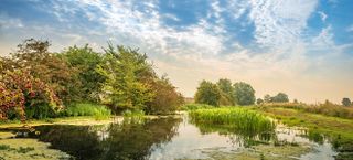 The wetlands and lowlands of the Lincolnshire Fens during an early Autumn morning near Kate's Bridge, Thurlby, South Lincolnshire