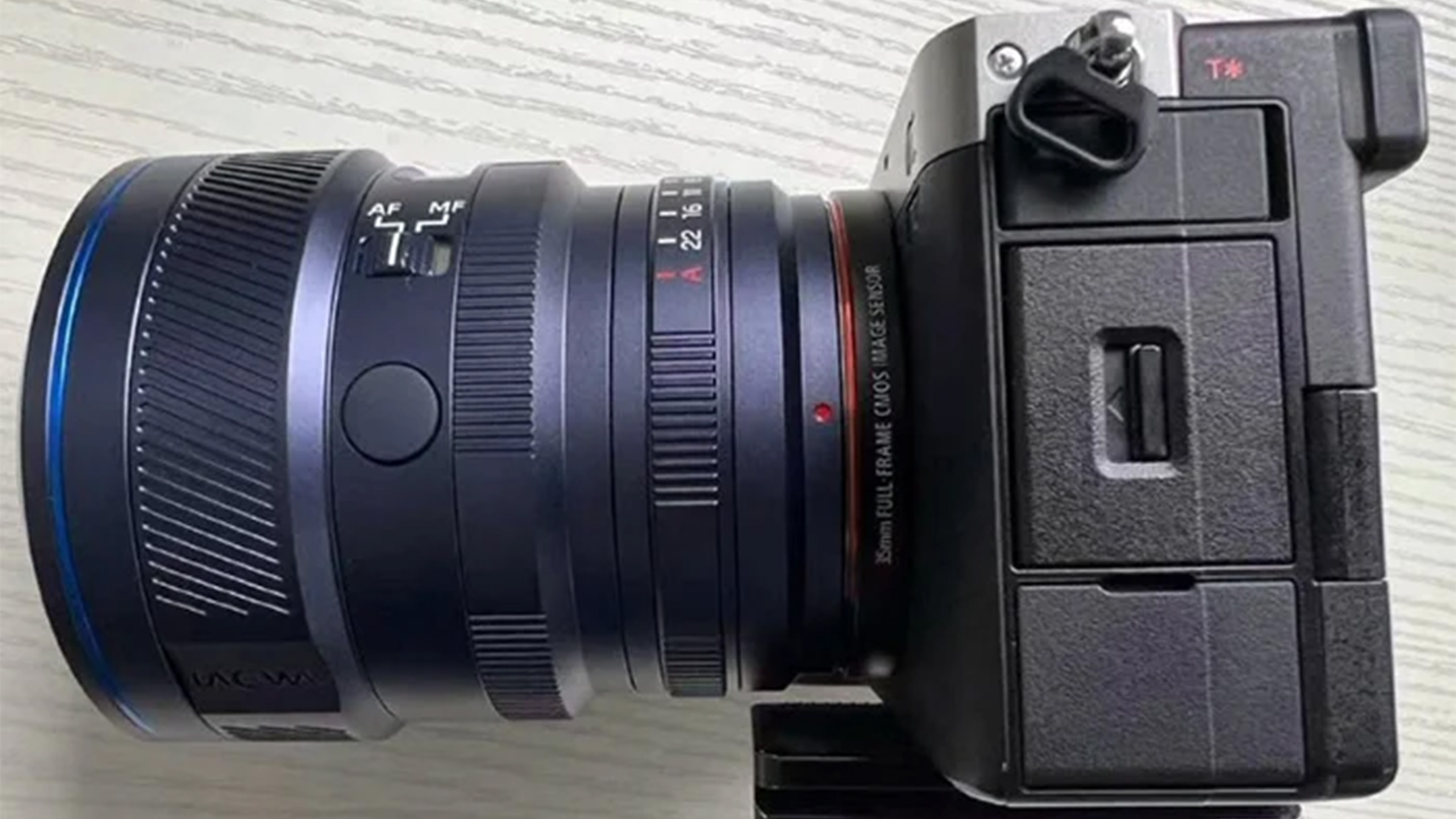 A black camera with a lens attached