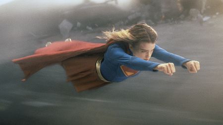 Milly Alcock's Kara Zor-El wearing her classic superhero suit as she flies through the air in 2026's Supergirl movie