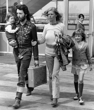 Black and white image of paul and linda mccartney with their two children