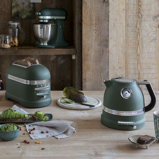 kitchen with kettle and toaster on wooden table