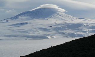 Majestic Erebus, topped with a swirl of clouds.