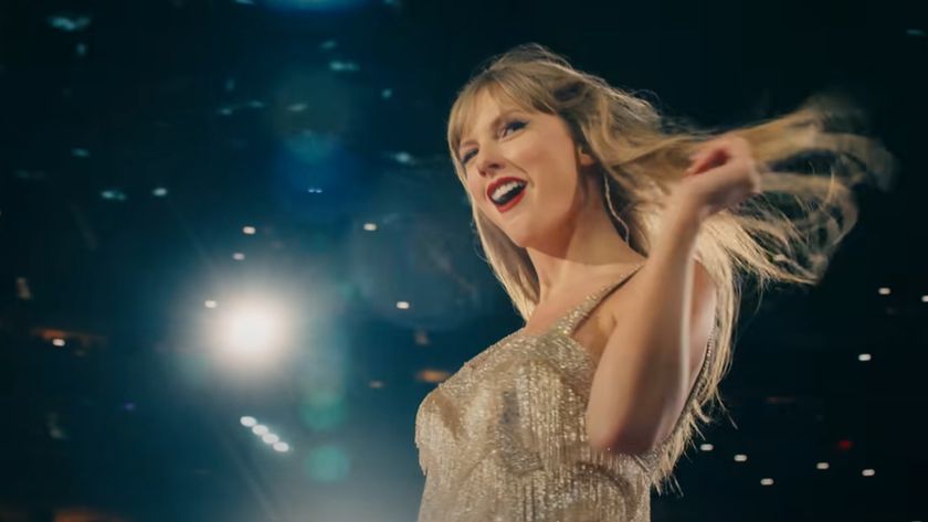 Taylor Swift flipping her hair in Fearless dress.