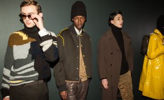 Three male models modelling Boss clothing in shades of brown.