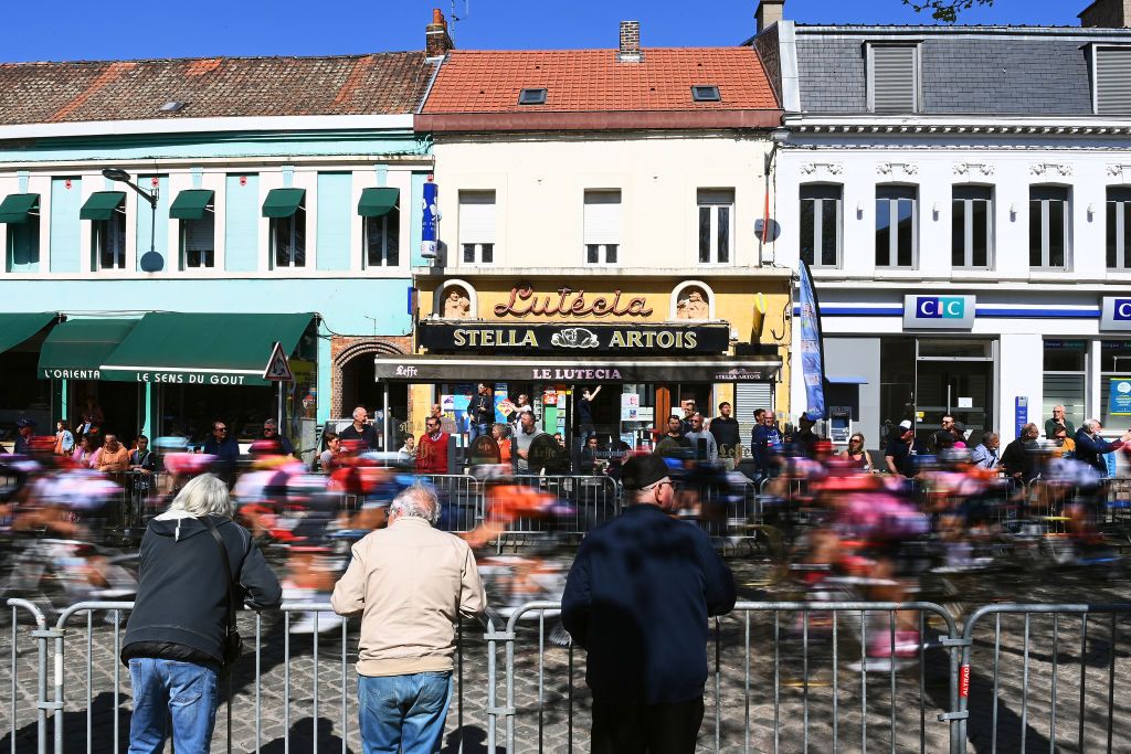 ROUBAIX FRANCE APRIL 16 A general view of the peloton at Denain start city while fans cheer prior to the 2nd ParisRoubaix 2022 Womens Elite a 1247km one day race from Denain to Roubaix ParisRoubaixFemmes ParisRoubaix on April 16 2022 in Roubaix France Photo by Tim de WaeleGetty Images