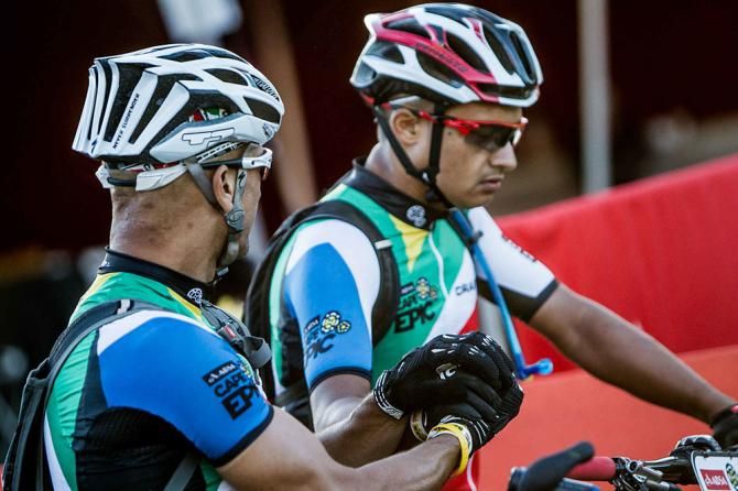 A team wishes each other luck on the start line