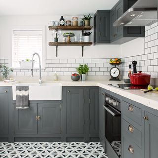 white kitchen with grey cabinets and drawers