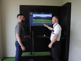 Barry Plummer talking to Custom Fit Specialist Steve about the data from his custom fit experience