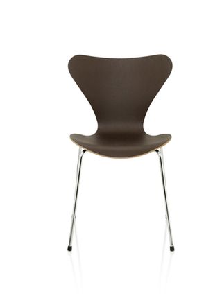 A brown wooden chair with metal legs