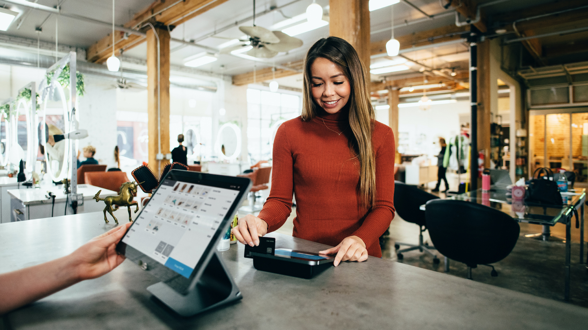 woman paying using a pos system