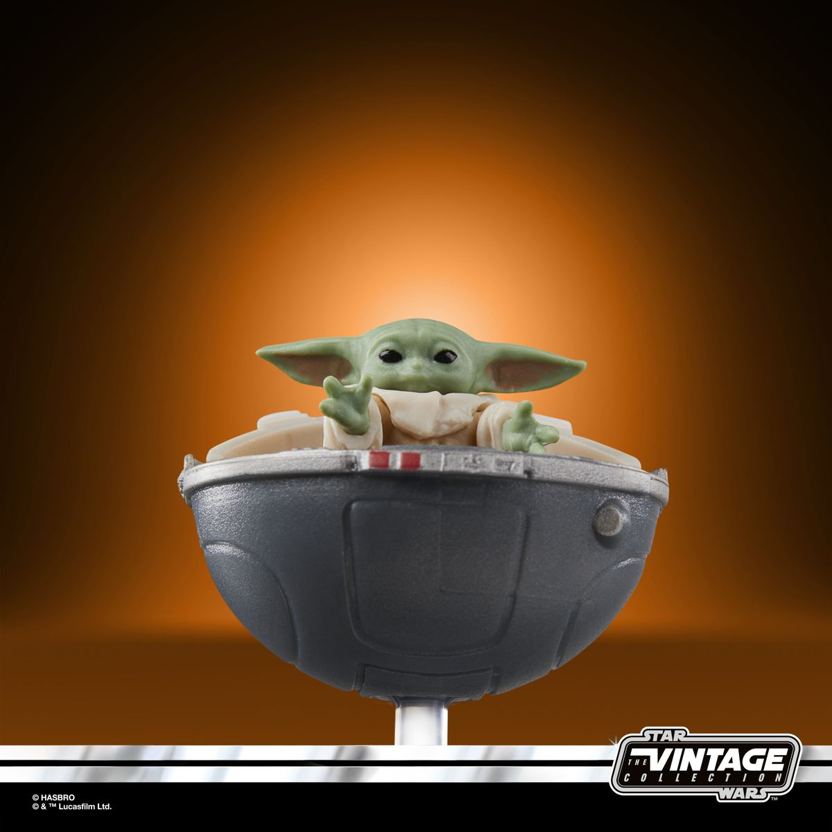 The Vintage Collection Grogu figure on an orange and black background