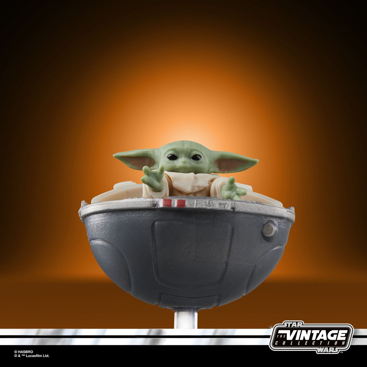 The Vintage Collection Grogu figure on an orange and black background
