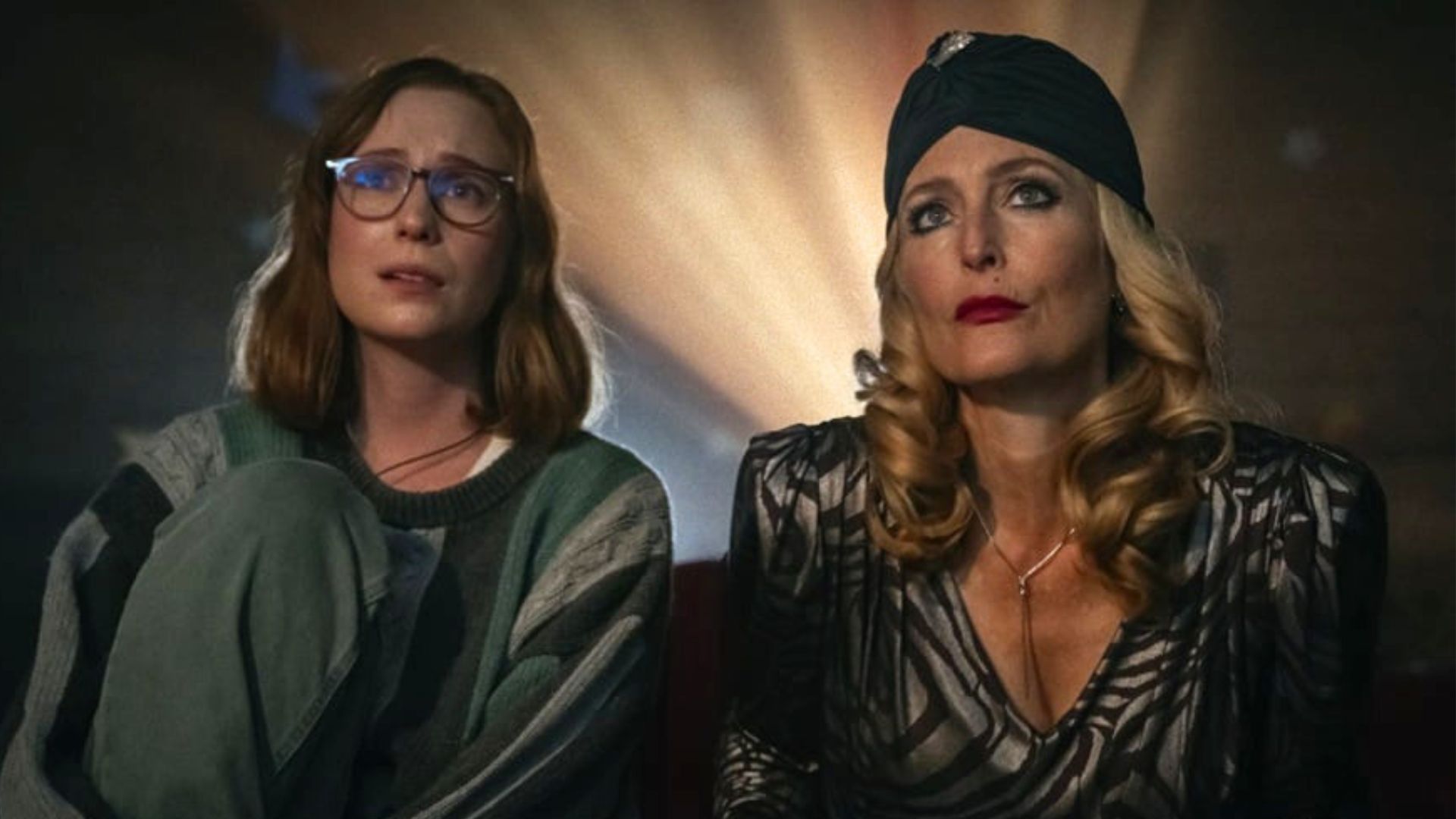 Kris and Billy watch a movie side by side