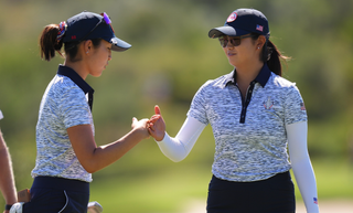 Andrea Lee and Rose Zhang fist bump at the Solheim Cup