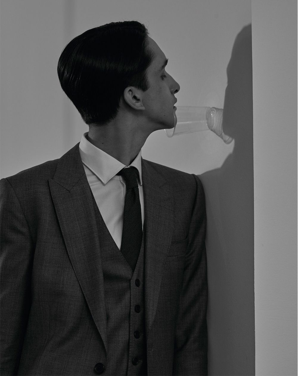 man in suit with plastic cup