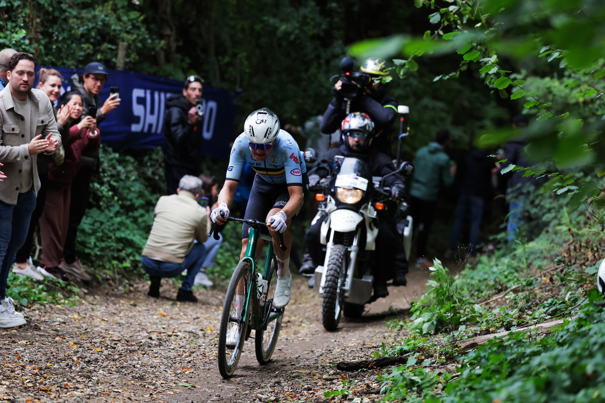 A TV camera follows Florian Vermeersch (Belgium) as he rides away to a victory at 2025 UCI Gravel World Championships in the Netherlands