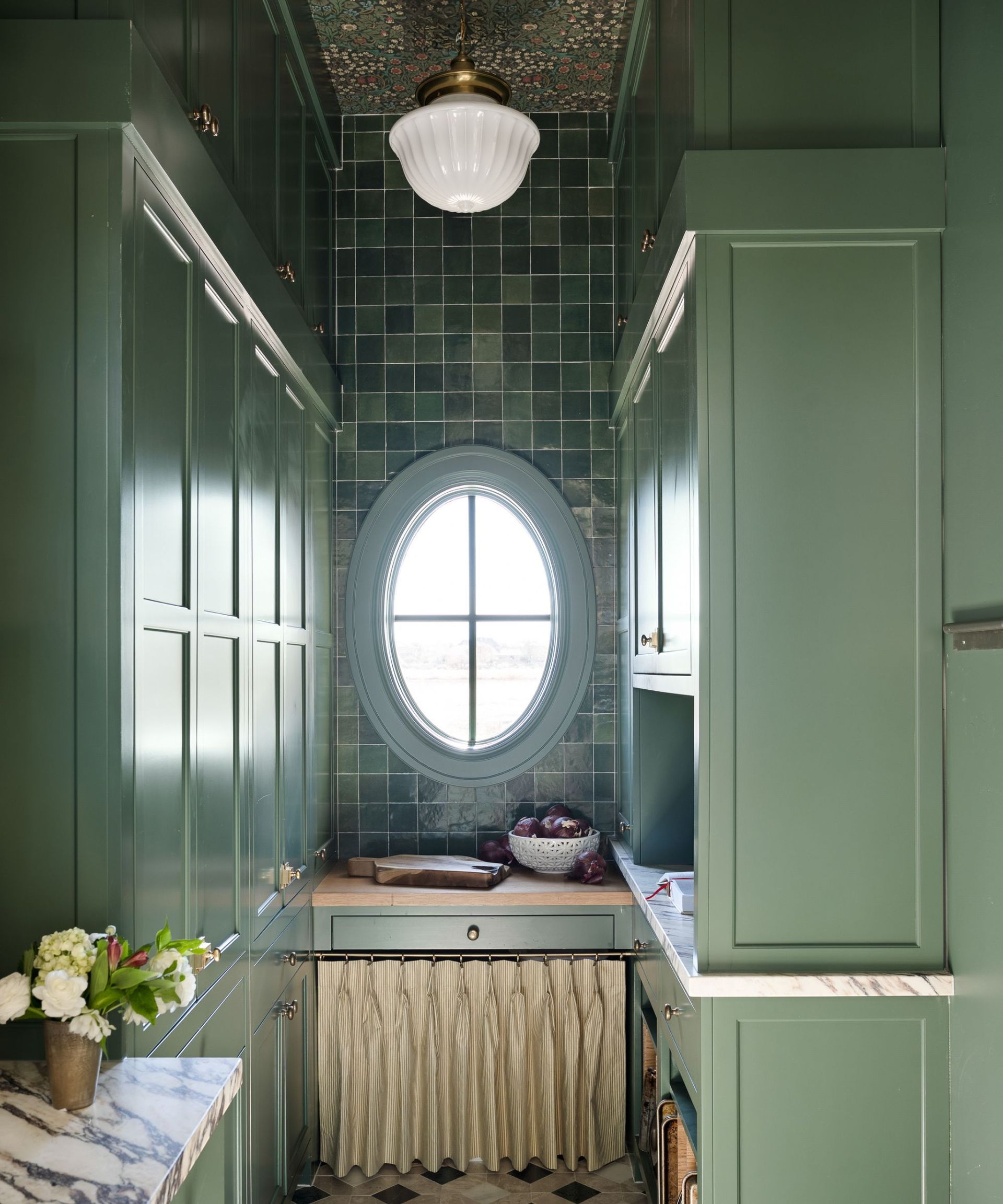 green kitchen with ceiling wallpaper and cabinet curtain