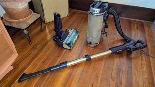 Shark PowerDetect Upright vacuum with wand and detail tool attached to flexible hose
