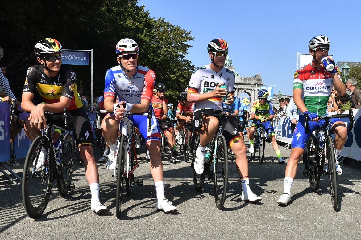 Lampaert, Demare, Ackermann, and Peak on the start line