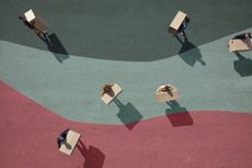 looking at six people carrying boxes from above with red, teal and green background