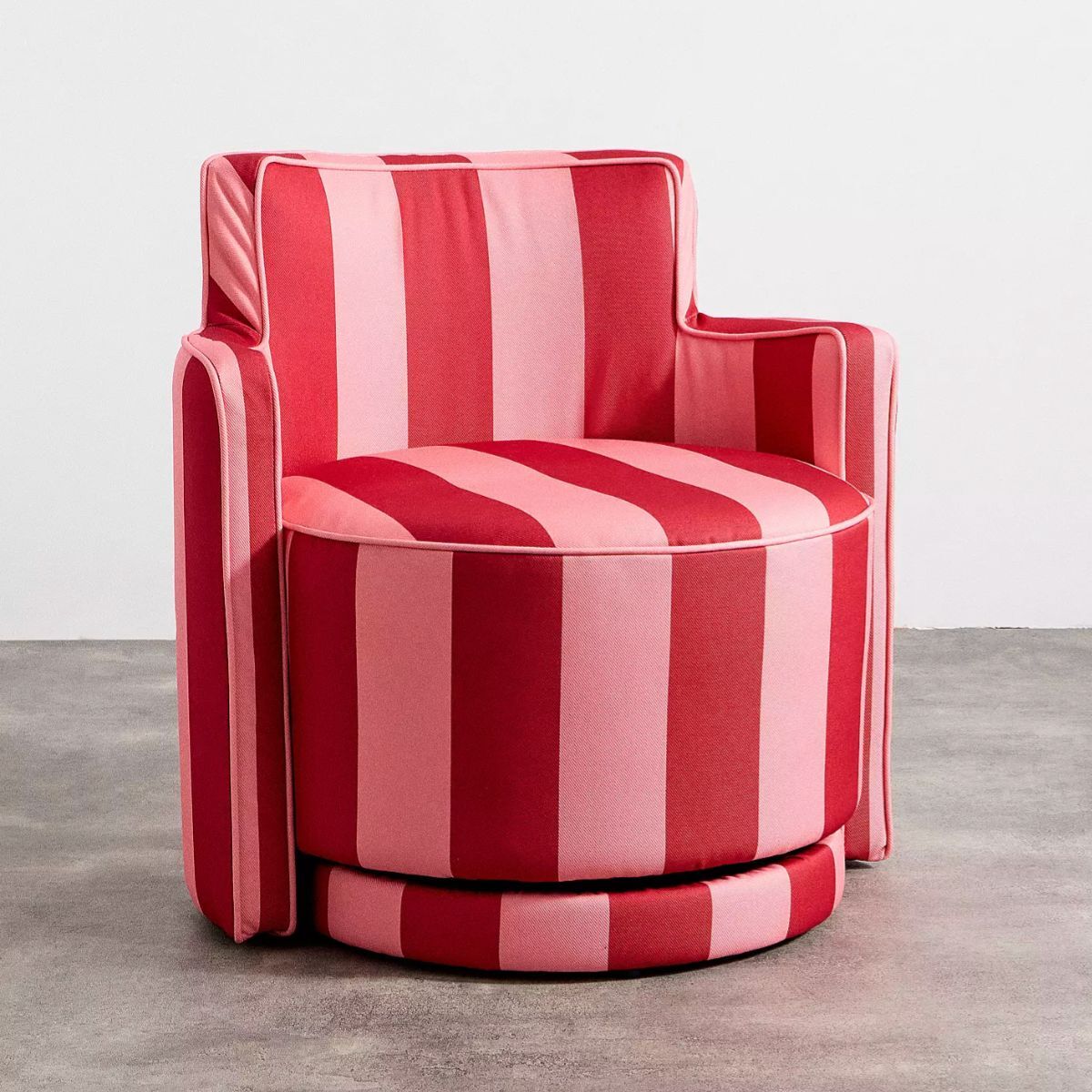 A pink and red swivel chair
