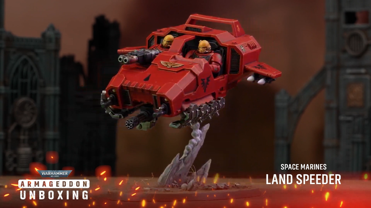 Warhammer 40K Space Marine models on a rocky battlefield