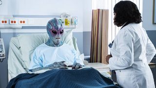 Resident Alien image showing Harry Vanderspeigle in a hospital bed